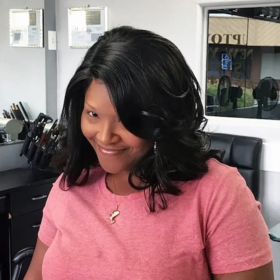 African American mother smiling with beautiful new hairstyles